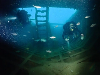 two diver inside a wreck