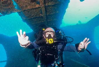 Rebreather diver diving in a wreck on an AP Inspiration