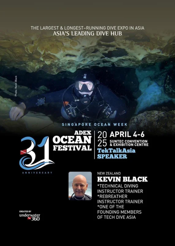 Kiwidiver Kevin Black on stage speaking at ADEX conference in Singapore