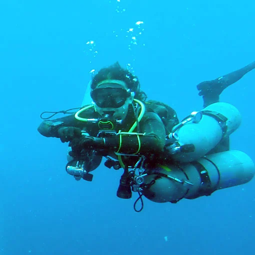 Sidemount diver conducting decompression stop in the blue
